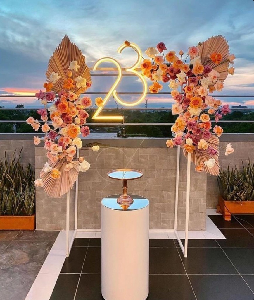 Colorful balloon and neon décor installation at a CieLA event