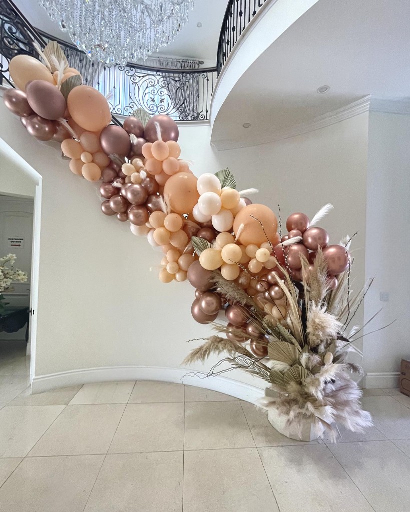 Event styling with balloons, florals, and custom signage