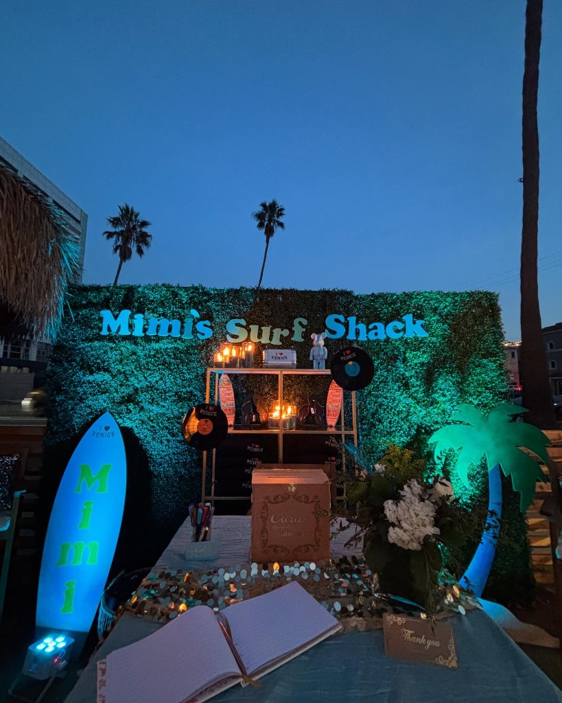 Outdoor evening performance with florals and warm stage lighting
