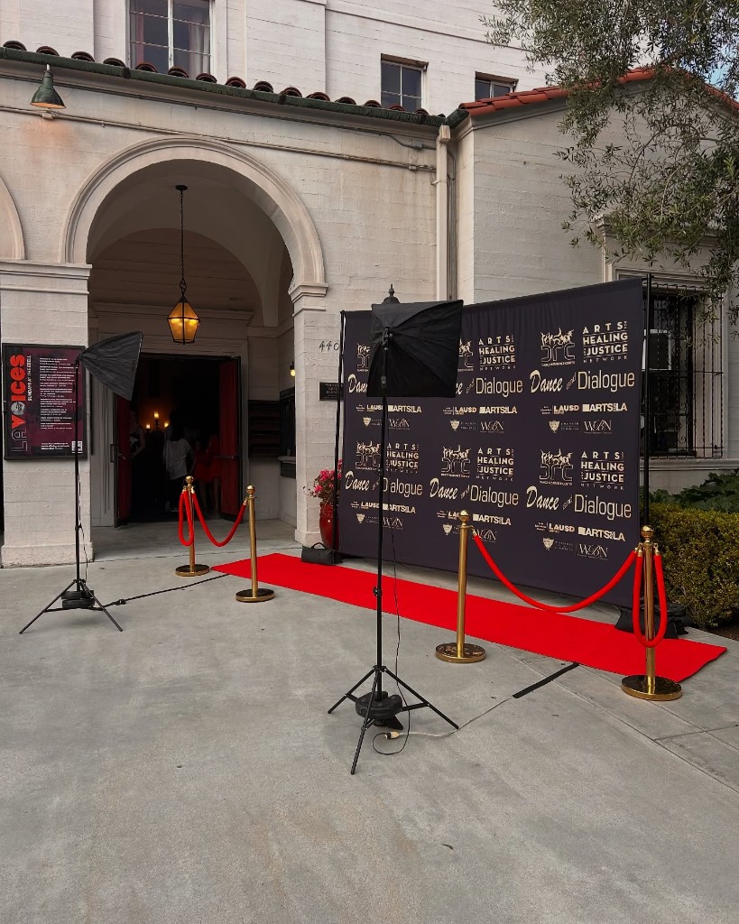 Graduation backdrop with cream balloon garland and custom signage