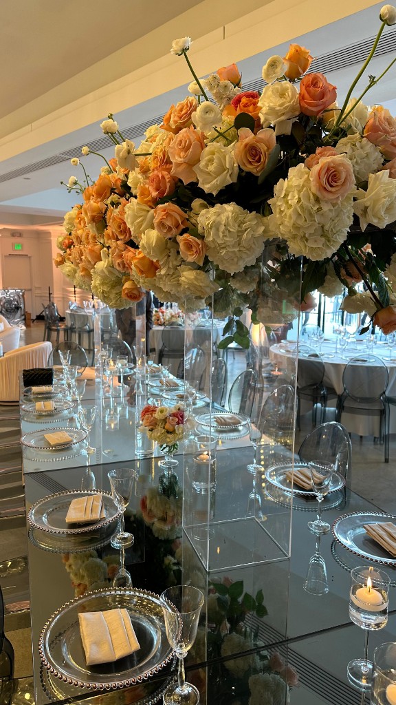 Blush reception tablescape with pampas centerpieces and gold chargers