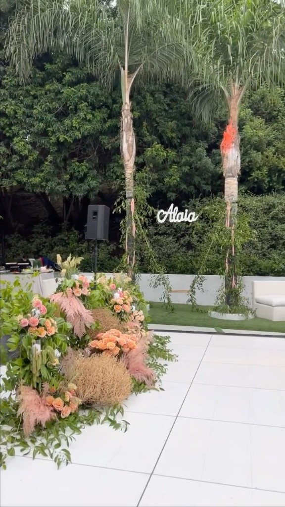 Yellow pergola garden dining table with lemon topiaries and hydrangeas