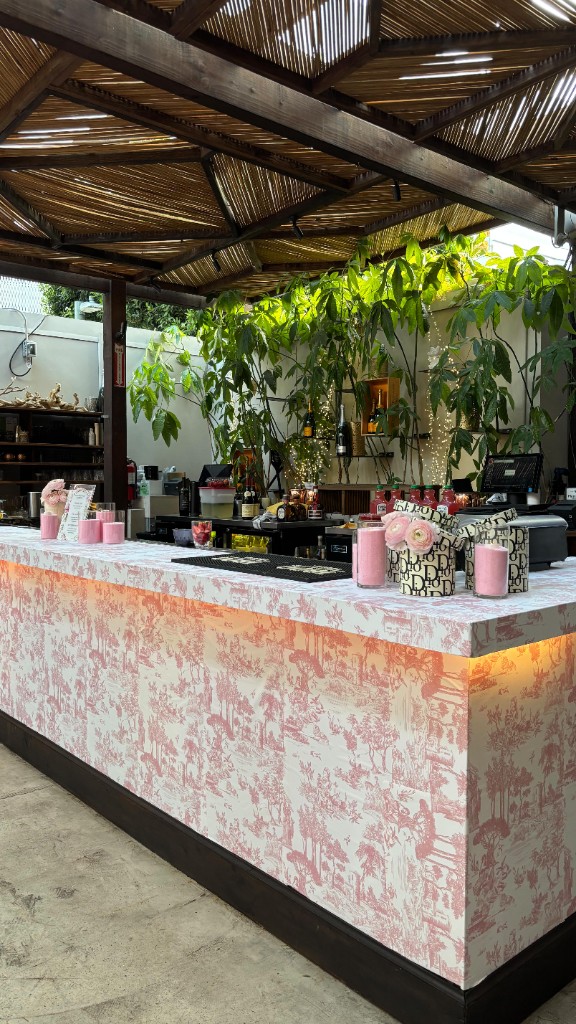 Luxury sushi catering station with marquee SUSHI letters